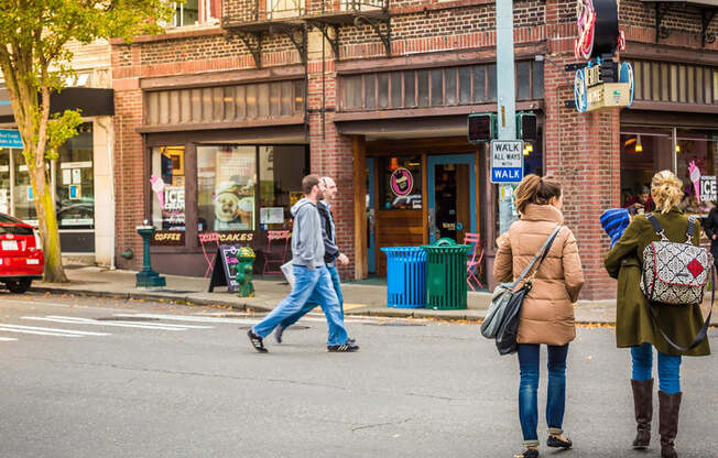 Group of People Walking in Downtown West Seattle Intersection