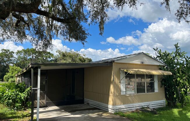 HUGE (3BR/2BA) w/Carport & Screened Porch Mobile Home-Water, Sewer & Trash Incl w/Rent