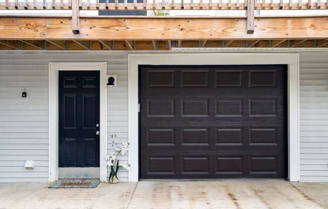 A black door is on the left and a brown door is on the right.