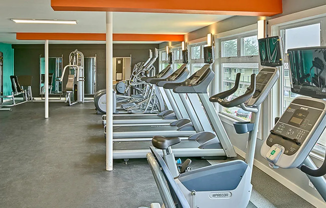 Apartments for Rent in Renton WA - Sunset View - Gym Equipment, Large Windows, Padded Floors, and Treadmills