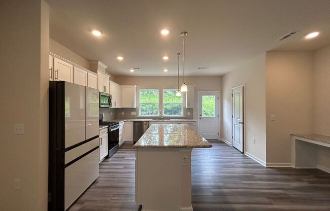 Stunning end-unit newly built 3 bedroom 2.5 bath townhouse in N High Point with attached garage.