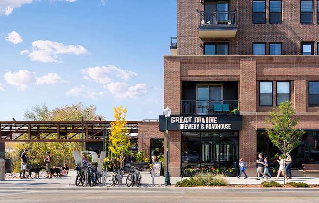 A street view of a building with the sign "Great Divide Brewery & Roadhouse".