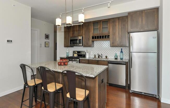 Fitted Kitchen With Island Dining at Bluestone Flats, Minnesota