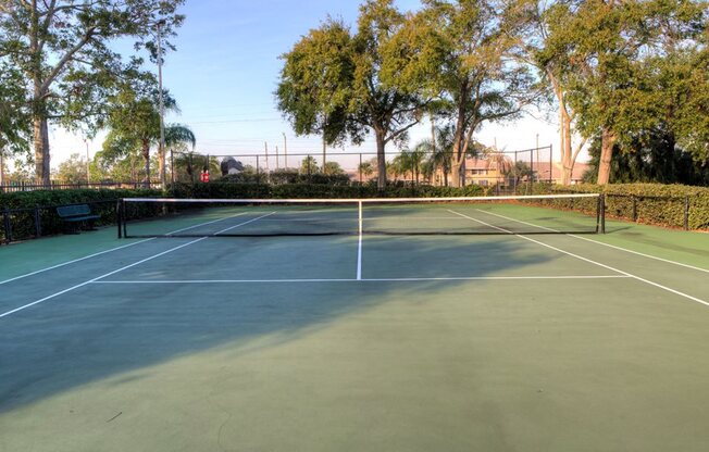 Two, hedge lined tennis courts offer a sweet spot for a game.