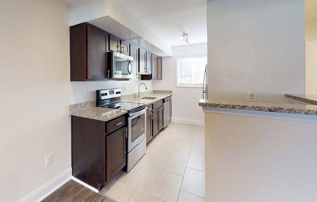 Large kitchen area with stainless steel appliances at Tysons Glen Apartments and Townhomes, Falls Church, VA