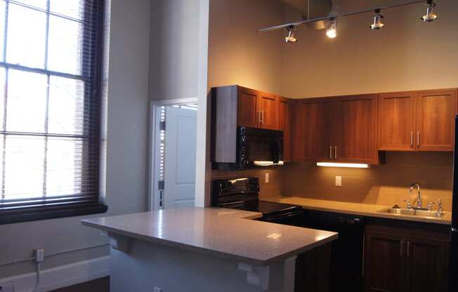 an empty kitchen with an island in the middle at Residences at South High, Pittsburgh Pennsylvania ? 