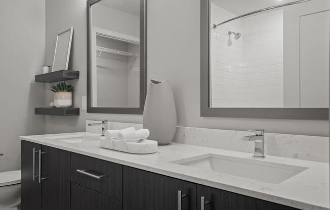 Dual vanities and framed mirrors in bathrooms