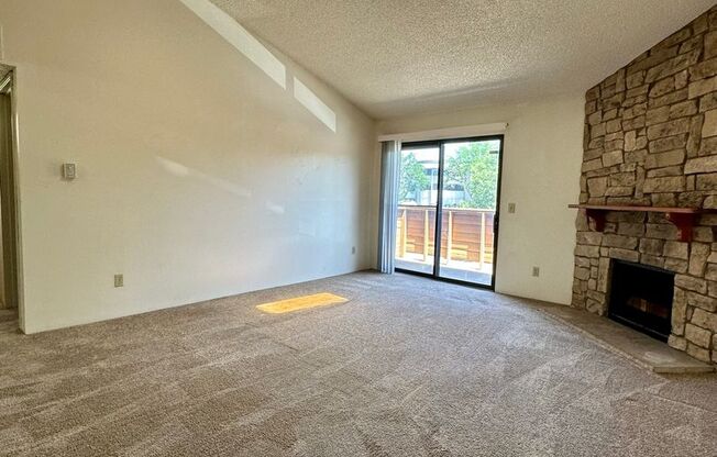 Spacious and Bright Top-Floor Apartment with Skylights, Fireplace, and Balcony in Sought-After Location