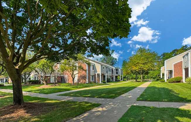 Private-Entry apartment buildings in Southfield with a walkway and sidewalk.