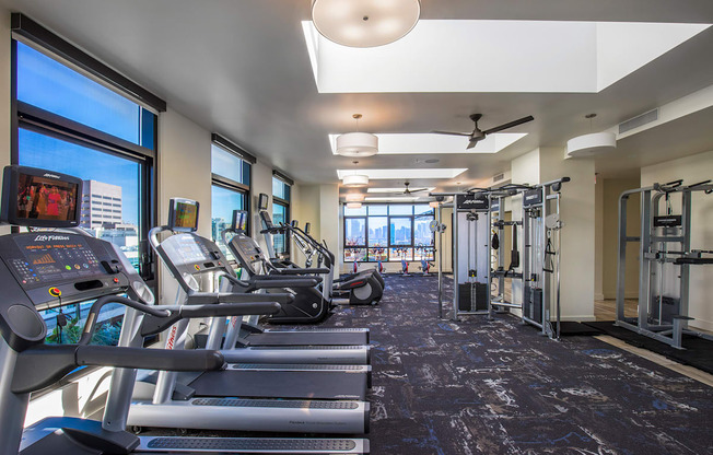 A gym with treadmills and exercise equipment.