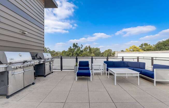 a patio with a grill and a table and chairs at Barrington 101, Illinois, 60010