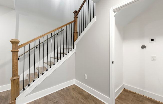 The landing of a staircase in the living room at Crogman School Lofts, Atlanta, 30315