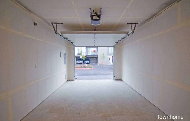 A long, empty garage with a view of the street outside at Spyglass Hill Apartments, Washington