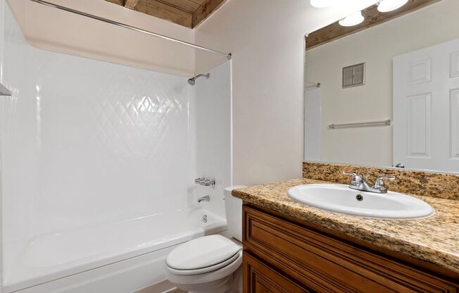 a bathroom with a sink toilet and bathtub