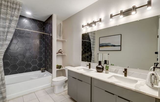 a bathroom with a sink and a toilet and a tub