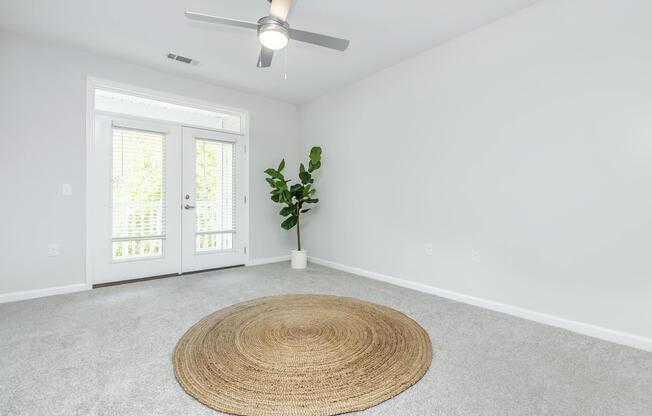 a room filled with furniture and vase of flowers