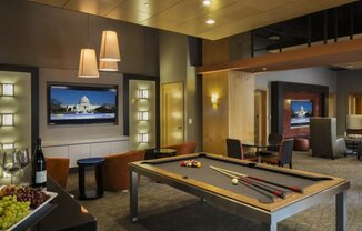 a game room with a pool table and a television