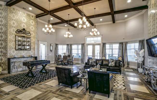 a large living room with a pool table and couches