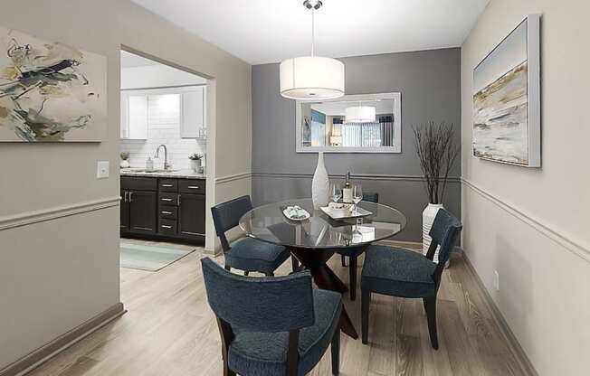 Dining area with pendant lighting, plank-style flooring, and model dining set at The Madison Franklin, Tennessee, 37064