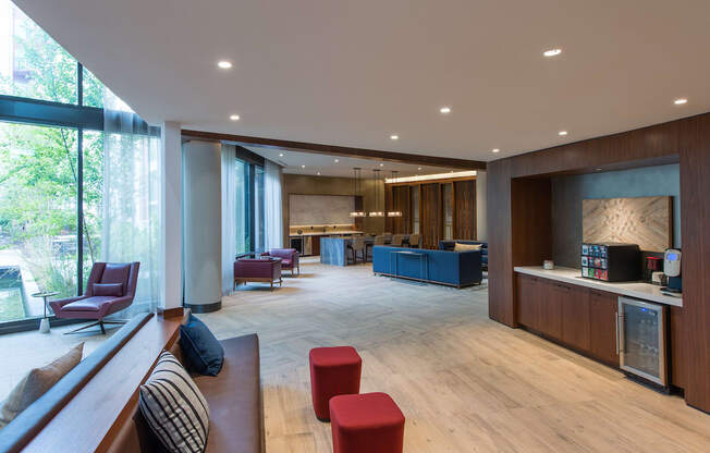 the lobby of a hotel with a reception desk and a seating area