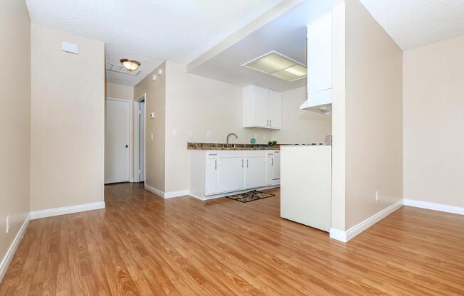 a kitchen with a wood floor
