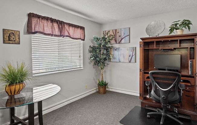 an office with a desk and a chair