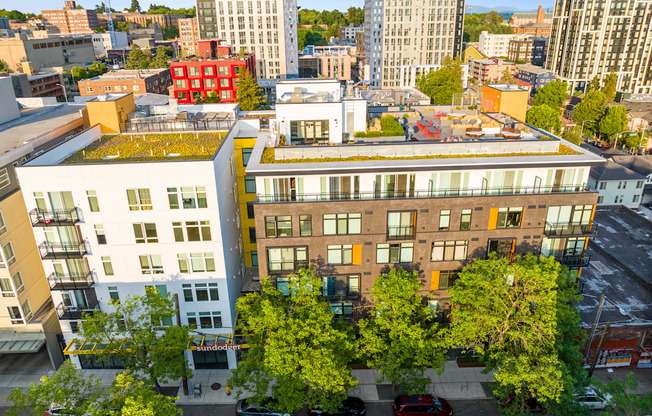 an aerial view of a building with a green roof