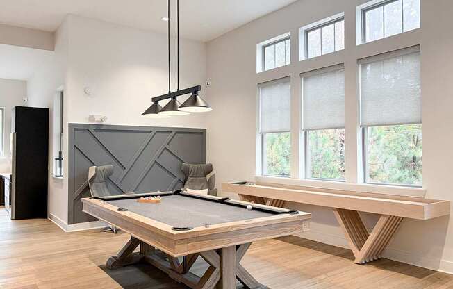 Gaming lounge with fireplace and TV