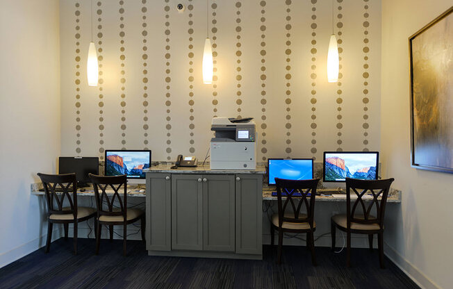 a room with a bunch of computers on a table  at Cabana Club - Galleria Club, Florida, 32256