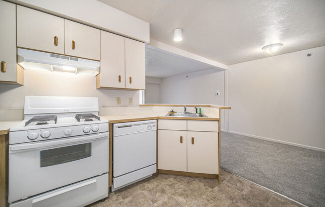 a kitchen with breakfast bar at Canal 2 Apartments, Lansing, 48917