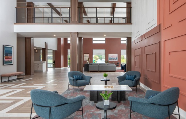 A living room with a couch, chairs, and a coffee table.