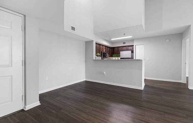 A kitchen area with a countertop and cabinets.