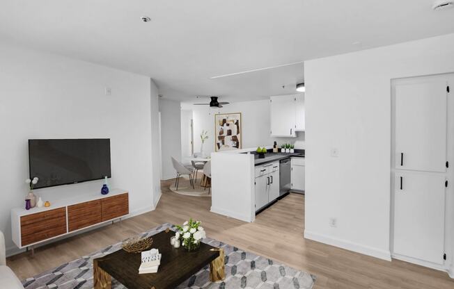 a living room with a table and a television