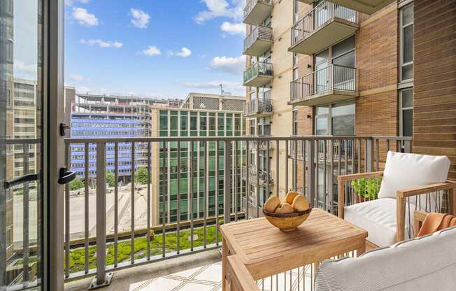 a balcony with a chair and a table