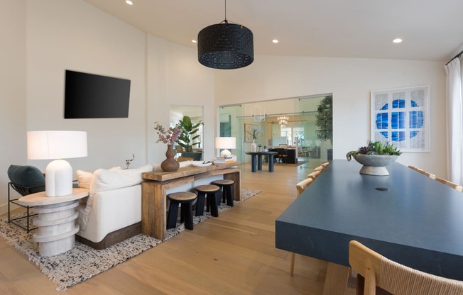 a rendering of the lobby of a restaurant with a long bar with stools