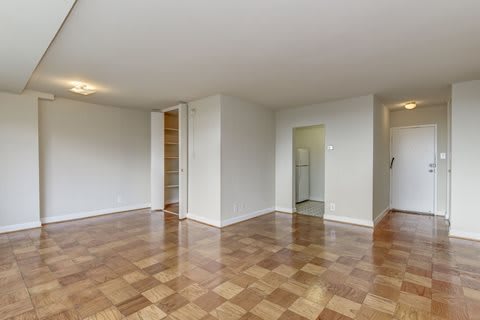 A room with a checkered floor and white walls.