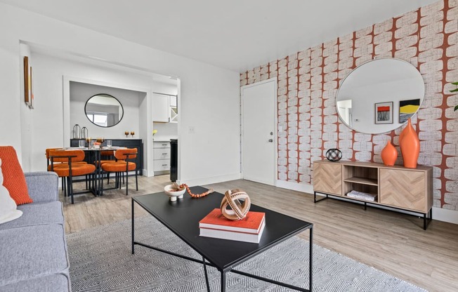 a living room with a couch and a coffee table  at Park On Canal Apartments, Clinton Twp, Michigan