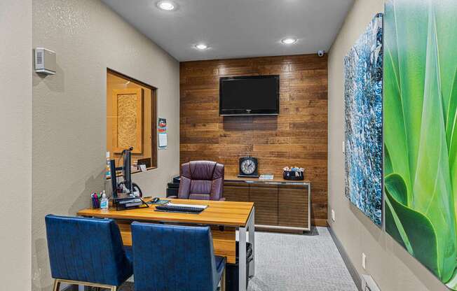 A room with a wooden wall and a television mounted on it.
