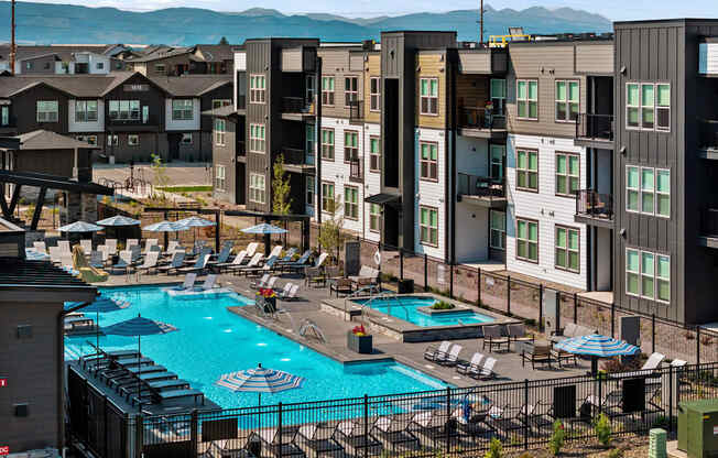 an aerial view of a swimming pool at an apartment complex