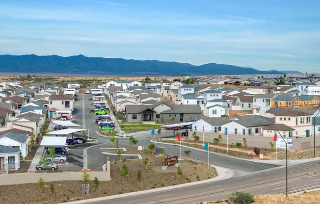 A suburban neighborhood with houses and a road.