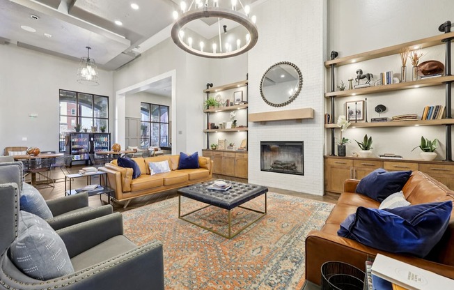 A living room with a fireplace and a large mirror on the wall.