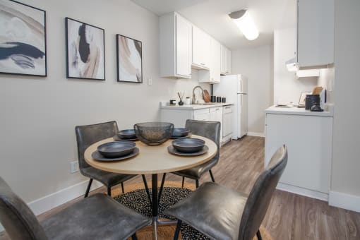 Model Apartment dining room with a table and chairs and a kitchen