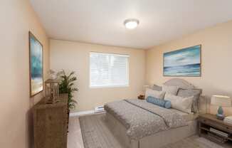 a bedroom with a bed and a painting on the wall