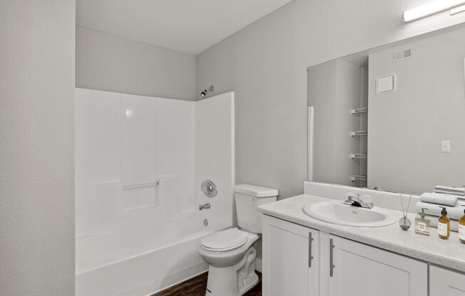 a bathroom with a toilet sink and bathtub