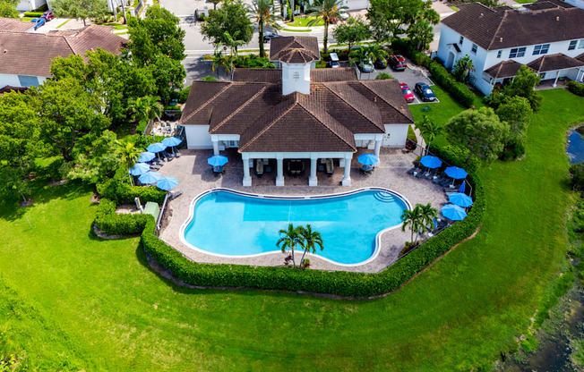 A large house with a pool in the backyard.
