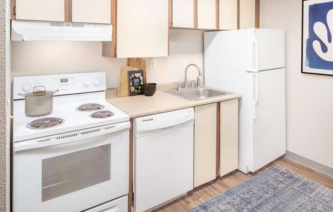 Kitchen With White Cabinetry And Appliances at Veri at Timberhill, Corvallis