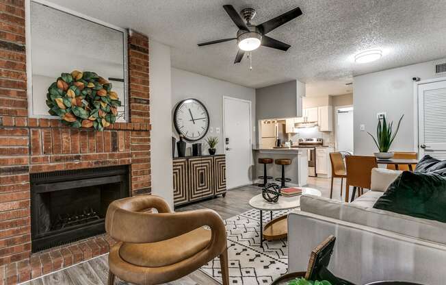 Brick Fireplace and ceiling fan