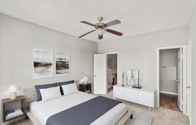a bedroom with a large bed and a ceiling fan at Veranda at Centerfield, Houston, TX
