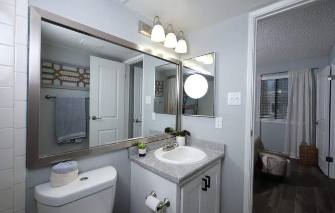 Apartments in Haltom City, TX for Rent - Desert Sands Apartments - Classic Bathroom Leading into Bedroom