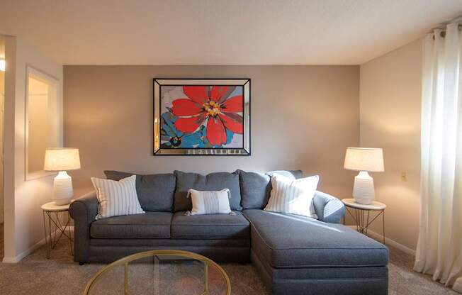 This is a photo of the living room in the 822 square foot, 2 bedroom, 1 bath floor plan at Village East Apartments in Franklin, OH.